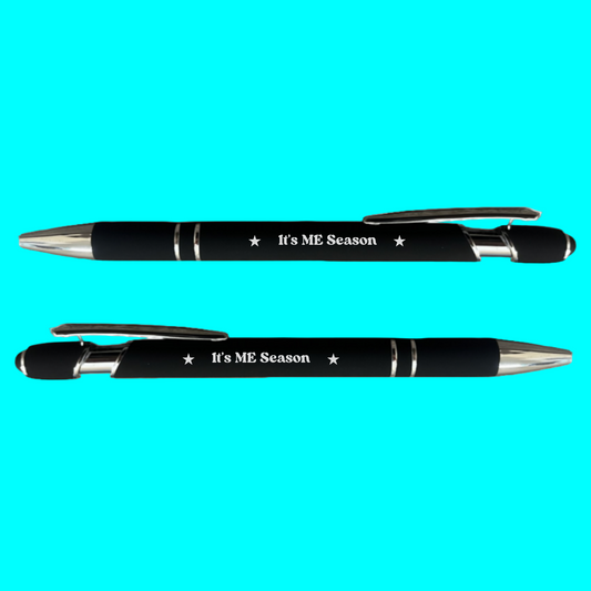 Two black pens with 'It's ME Season' text on a turquoise background
